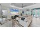Bright living room featuring a large television, comfortable seating and neutral color palette at 7108 Harle Ave, North Port, FL 34291