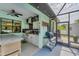 An outdoor kitchen with stainless steel grill, countertop, and appliances at 7108 Harle Ave, North Port, FL 34291