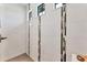 Modern walk-in shower with glass door, stone tile accents, and recessed lighting at 7108 Harle Ave, North Port, FL 34291
