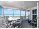 Inviting screened balcony with seating area, offering stunning views of the beach and ocean at 7466 Palm Island Dr # 2913, Placida, FL 33946