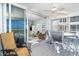 Relaxing screened balcony featuring comfortable seating and breathtaking beach views, perfect for enjoying the ocean breeze at 7466 Palm Island Dr # 2913, Placida, FL 33946