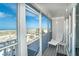 Relaxing screened balcony with lounge chair, boasting picturesque views of the beach and boardwalk at 7466 Palm Island Dr # 2913, Placida, FL 33946