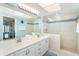 Beautiful bathroom with double vanities, a spacious shower, and a view of the bedroom and ocean at 7466 Palm Island Dr # 2913, Placida, FL 33946