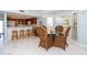 Inviting dining area features wicker seating, a bar, and a view into a well-appointed kitchen at 7466 Palm Island Dr # 2913, Placida, FL 33946