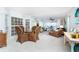Light-filled dining area with a glass-top table, wicker chairs, and views of the ocean beyond the lanai at 7466 Palm Island Dr # 2913, Placida, FL 33946