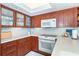 Kitchen showcasing wood cabinets, white countertops, modern appliances, and recessed lighting at 7466 Palm Island Dr # 2913, Placida, FL 33946