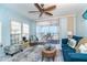 Inviting living room with a comfortable sofa, lanai access, and panoramic ocean views for relaxed living at 7466 Palm Island Dr # 2913, Placida, FL 33946