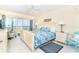 Serene main bedroom with balcony access and ocean views, providing a tranquil retreat at 7466 Palm Island Dr # 2913, Placida, FL 33946