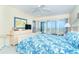 Comfortable main bedroom offering balcony access and scenic ocean views for a peaceful getaway at 7466 Palm Island Dr # 2913, Placida, FL 33946