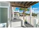 View from the porch with white railings, showing a palm tree and neighboring buildings at 7466 Palm Island Dr # 2913, Placida, FL 33946