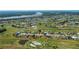 Aerial view showing the golf course community and the location of the home marked with an arrow at 81 Oakland Hills Pl, Rotonda West, FL 33947