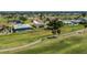 Aerial view of the home's surroundings, located on a golf course community at 81 Oakland Hills Pl, Rotonda West, FL 33947