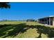 Large backyard, perfect for recreation, with a screened in lanai and golf course views at 81 Oakland Hills Pl, Rotonda West, FL 33947