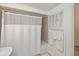 Bathroom featuring a shower/tub combo and neutral-toned tiles at 81 Oakland Hills Pl, Rotonda West, FL 33947