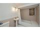 Cozy bathroom featuring a pedestal sink, tiled shower/tub, and neutral color palette at 81 Oakland Hills Pl, Rotonda West, FL 33947