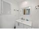Clean bathroom featuring a white vanity, modern faucet, and ample counter space at 81 Oakland Hills Pl, Rotonda West, FL 33947