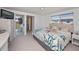 Comfortable bedroom with an ensuite bathroom and lanai access at 81 Oakland Hills Pl, Rotonda West, FL 33947
