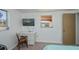 Bright bedroom featuring a desk and a view of the neighborhood at 81 Oakland Hills Pl, Rotonda West, FL 33947