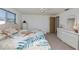 Comfortable bedroom with coastal themed comforter and white wicker furniture at 81 Oakland Hills Pl, Rotonda West, FL 33947