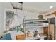 Garage storage with palm tree mural at 81 Oakland Hills Pl, Rotonda West, FL 33947