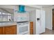 Updated kitchen showcasing white appliances, wood cabinetry, and modern accents for cooking at 81 Oakland Hills Pl, Rotonda West, FL 33947