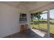 The lanai features a pass through window and access to the backyard at 81 Oakland Hills Pl, Rotonda West, FL 33947