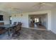View of the home's interior from the enclosed lanai with outdoor seating area at 81 Oakland Hills Pl, Rotonda West, FL 33947