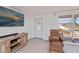 Welcoming living room with plush leather seating, modern decor, and serene outdoor views at 81 Oakland Hills Pl, Rotonda West, FL 33947