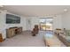 Cozy living room with recliner, and large window offering outdoor views at 81 Oakland Hills Pl, Rotonda West, FL 33947