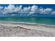 A calm beach scene with white sand and turquoise water, creating a tranquil and inviting atmosphere at 8714 King St, Placida, FL 33946