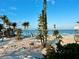 Beautiful beach scene with palm trees and clear blue water, showcasing the property's stunning coastal location at 8714 King St, Placida, FL 33946