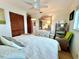 Inviting bedroom with closet and ensuite, coastal decor, and hardwood floors at 8714 King St, Placida, FL 33946