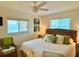 Relaxing bedroom with ocean view, natural light, and comfortable furnishings at 8714 King St, Placida, FL 33946