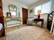 Comfortable bedroom featuring a decorative mirror, lamp, closet, and a wicker chair at 8714 King St, Placida, FL 33946