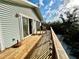 A great view from this home's wooden deck, with views of sand, sky and greenery at 8714 King St, Placida, FL 33946