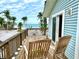 Beautiful home with a deck overlooking a white sandy beach and the ocean at 8714 King St, Placida, FL 33946