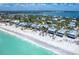 Aerial view of charming beachfront homes nestled along a pristine shoreline at 8812 Grand Ave, Placida, FL 33946