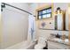 Well-lit bathroom features subway tile in the shower/tub and stylish fixtures at 8812 Grand Ave, Placida, FL 33946