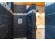 Custom shower with stylish tile work, shower niche, and access to the double sink vanity at 8812 Grand Ave, Placida, FL 33946