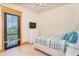 Comfortable bedroom features a large window with bright light and an elegant white dresser at 8812 Grand Ave, Placida, FL 33946