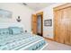 Bright bedroom with a map of Florida on the wall and natural trim throughout at 8812 Grand Ave, Placida, FL 33946