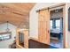 Bedroom with a wooden ceiling and a sliding barn door into another room at 8812 Grand Ave, Placida, FL 33946