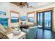 Bright living room with vaulted ceilings, offering ocean views and comfortable seating at 8812 Grand Ave, Placida, FL 33946