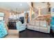A living area with a view of the kitchen, stairs, and modern furnishings at 8812 Grand Ave, Placida, FL 33946