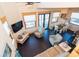 Comfortable living room with dark floors and bright natural light at 8812 Grand Ave, Placida, FL 33946