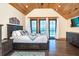 This main bedroom features access to a private balcony, offering stunning ocean views and natural light at 8812 Grand Ave, Placida, FL 33946