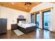 Main bedroom with a private balcony offering breathtaking views of the ocean at 8812 Grand Ave, Placida, FL 33946