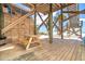 Inviting outdoor patio featuring a wooden picnic table with direct beach access at 8812 Grand Ave, Placida, FL 33946