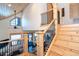 Open staircase featuring wood treads and iron balusters and lots of light at 8812 Grand Ave, Placida, FL 33946