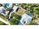 Aerial view of a home, outbuildings and tropical landscape at 941 Elwood Ave, Englewood, FL 34223
